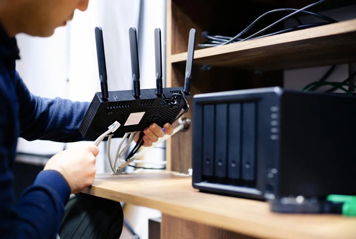 Technician installing smart home network devices