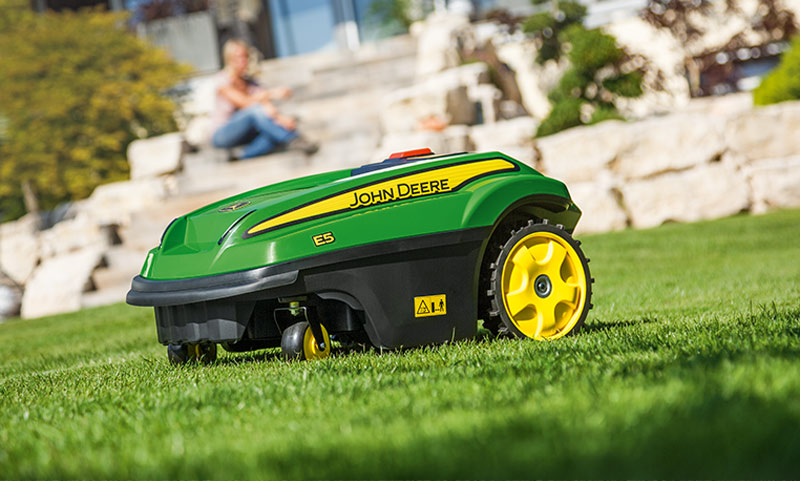 Robotic lawn mower maintaining a yard