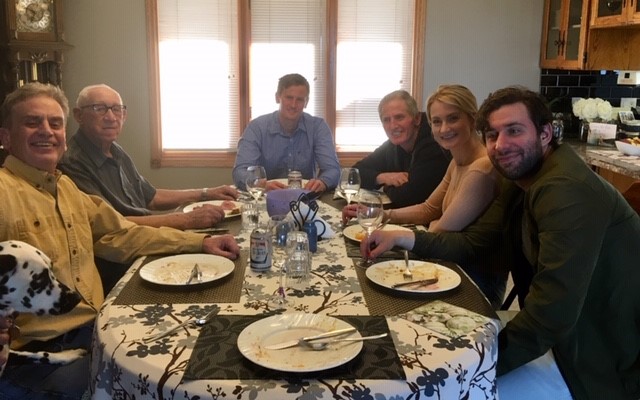 Family breakfast table with notebook and coffee