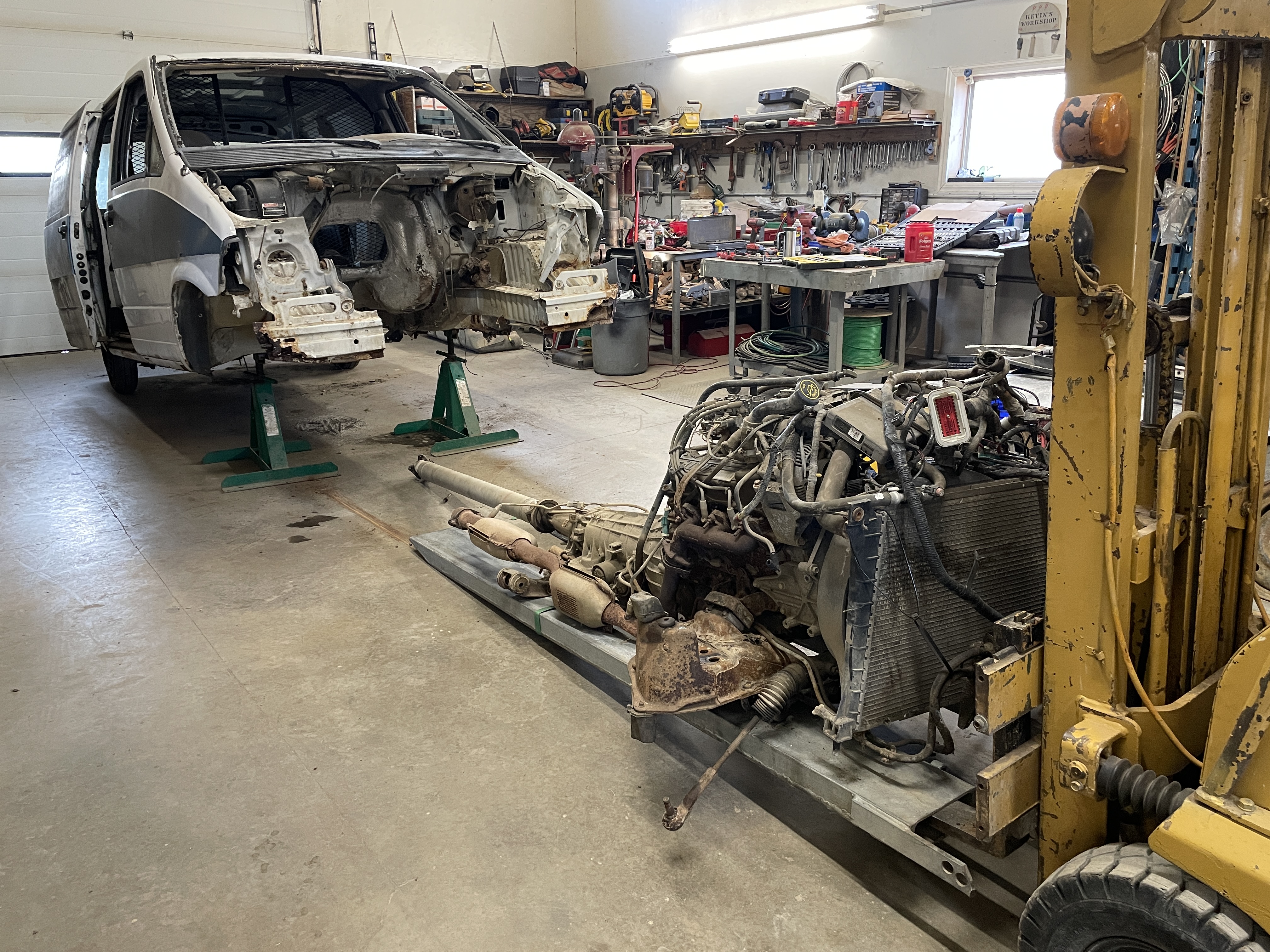 Welders, cutting torch, and torque wrenches on a bench