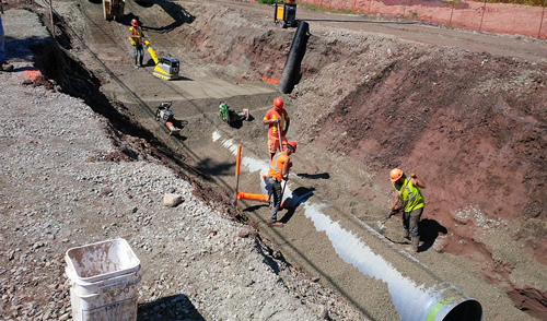 Construction supervisor coordinating a crew