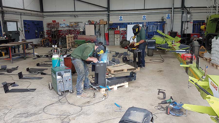 Welders, cutting torch, and torque wrenches on a bench